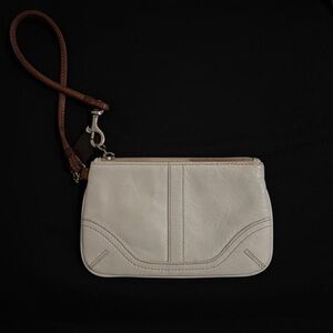 Coach cream and tan wristlet